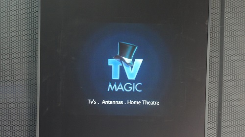 a vertical TV with TV Magic logo and services on scree