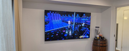 Wall mounted TV performed by Sam - TV Magic