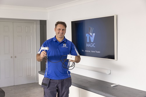 Technician holding a fresh TV point ready to replace a broken one.