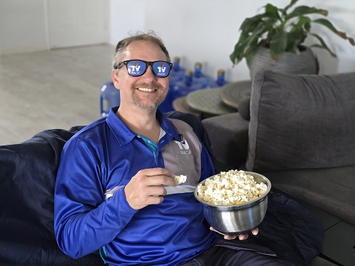 Technician wearing TV Magic sunnies, eating popcorn