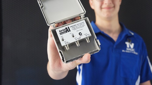 Technician holding a TV booster