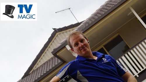 Brent - local technician in front of a home with a new antenna installation