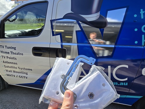 TV Points held up in front of van