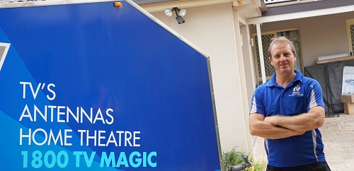 Technician - Brent next to his trailer