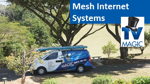 TV Magic van from a distance in trees. Caption "Mesh Internet Systems" on right, with TV Magic logo