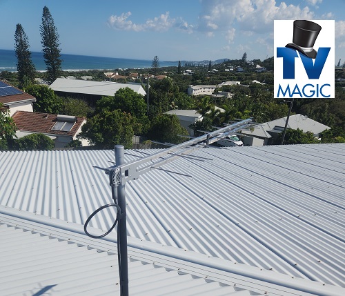 an antenna installed on a tin roof with TV magic logo in top right corner