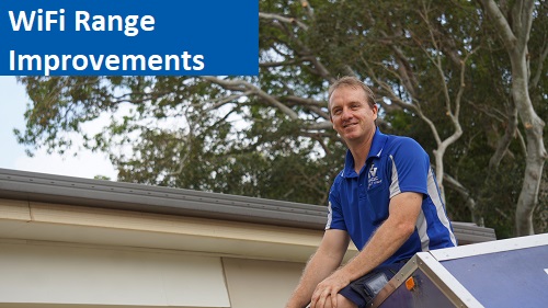 technician in front of a house. Caption "WiFi Range Improvments" in top left corner