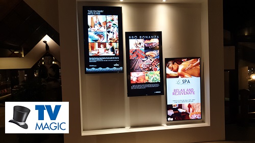 3 x vertical wall mounted display TV's with TV Magic logo in bottom left corner