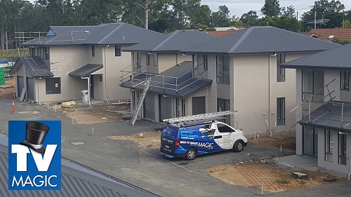 building site of a new home with a TV Magic van on site