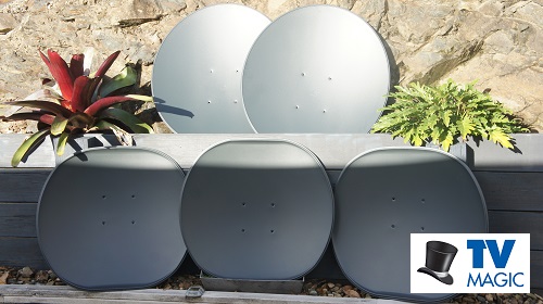 multiple satellite dishes leaning on a building with a TV Magic logo in bottom right corner
