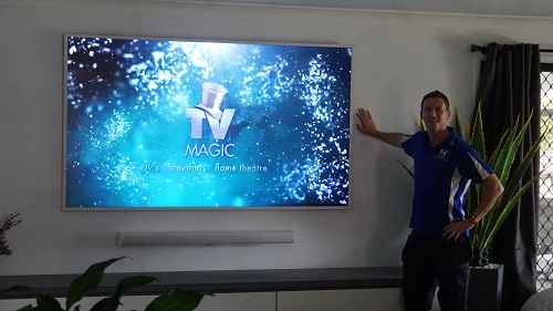 Jim with a big TV that he has just finished transporting