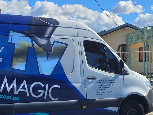 Large TV Magic van in front of a new home build