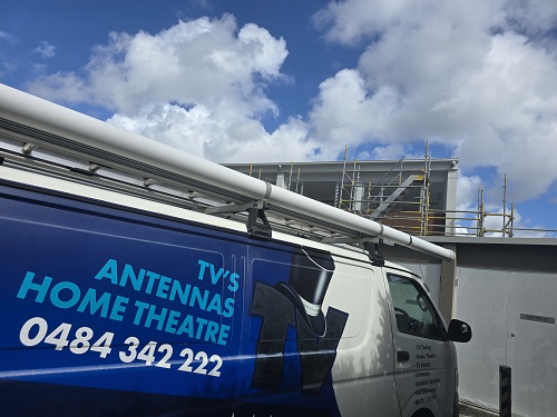 T Magic van in front of a build