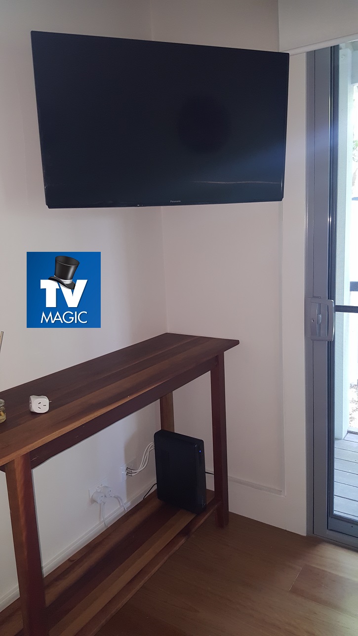 corner mounted tv near door 2025